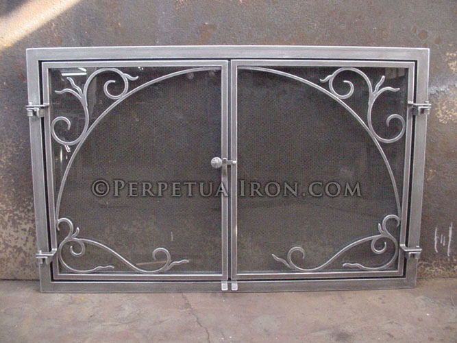Custom fireplace screen with double doors – glass and mesh.