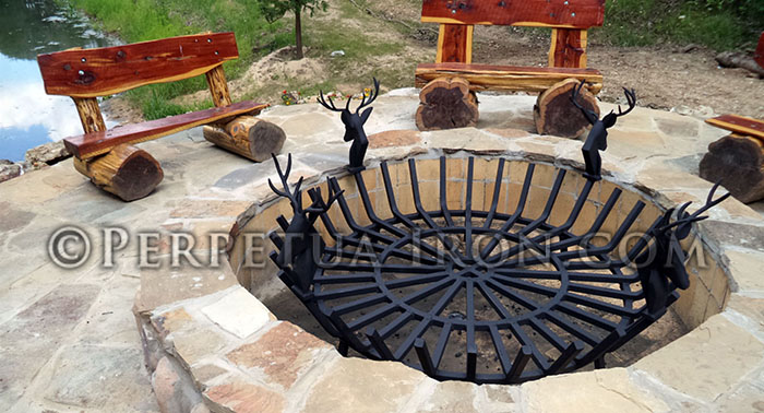 Large scale custom fireplace grate used in outdoor firepit.