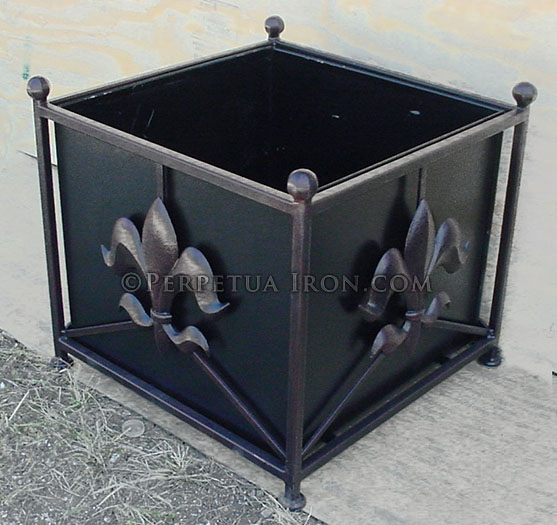 A large decorative iron planter box.