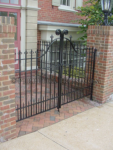 Double gate, wrought iron, hand forged design components.