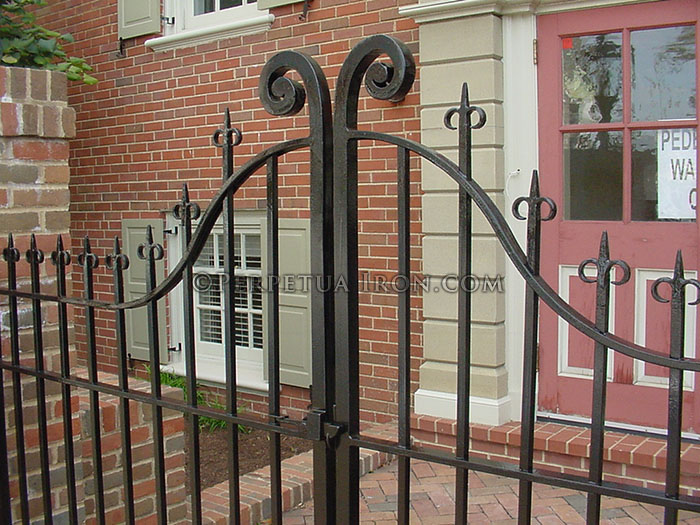 Detail of 10.1, wrought iron gate with hand forged design components.
