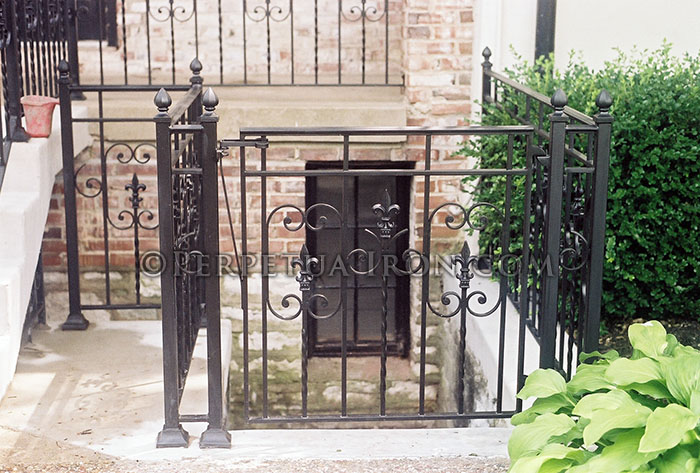 Custom iron gate for a basement entrance.