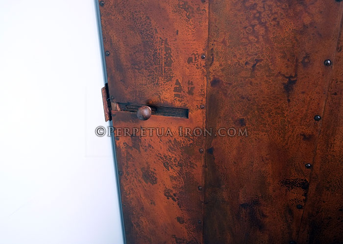 Rust patination on custom metal door.
