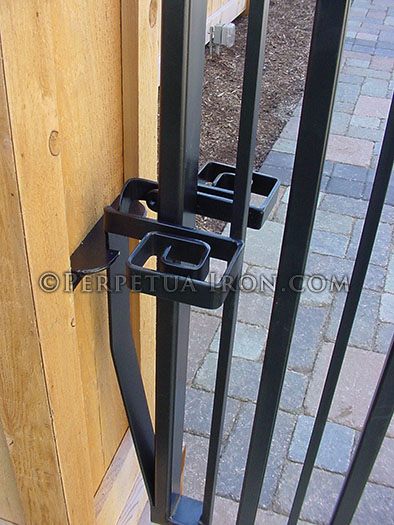 Custom spring latch on an iron gate.