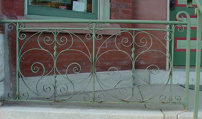 Complete view of old iron railing.