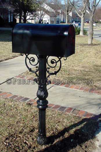 A stout ornamental mailbox post showing a tapered symmetrical design.
