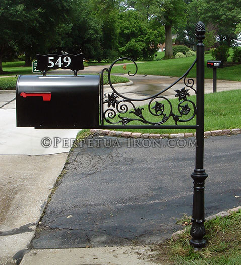 a custom mailbox post made to span a gap.
