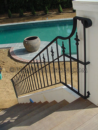 Exterior railing,  wrought iron, 3 channel design, fleur de lis finials.