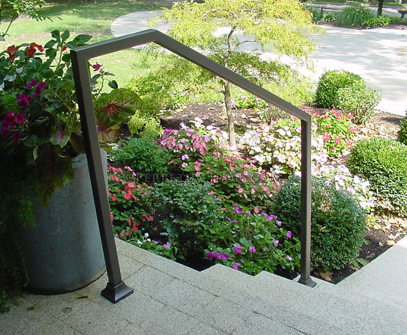 Exterior wrought iron handrail, modern design, 1.5” tubing, bronze color.