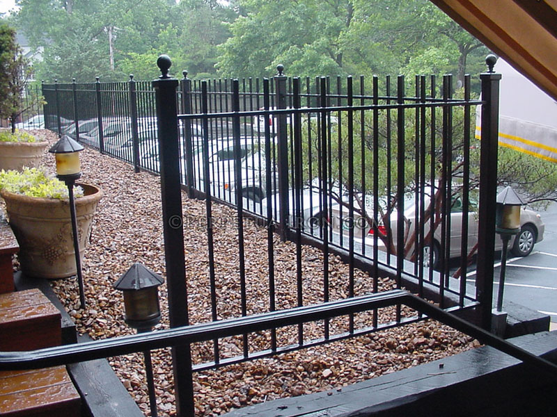 Exterior wrought iron railing, 2 channel design with ball cap finials.