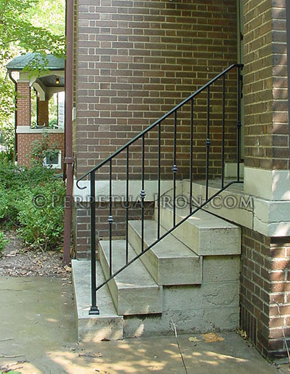Wrought iron railing for steps, classic design with alternating nodes.