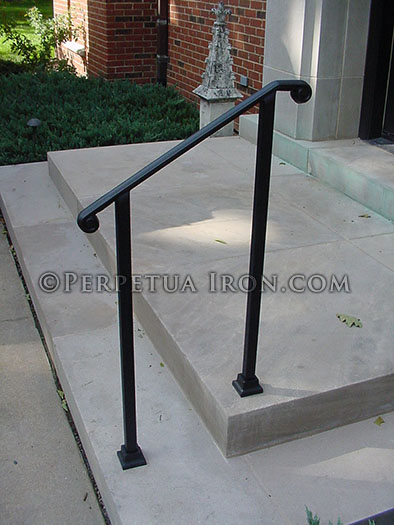 Simple, elegant wrought iron railing, no pickets, cast iron scroll ends.