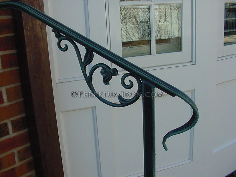 Detail of wrought iron lamb's tongue, antique green finish.