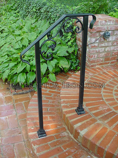 Wrought iron railing for garden steps, cast iron elements.