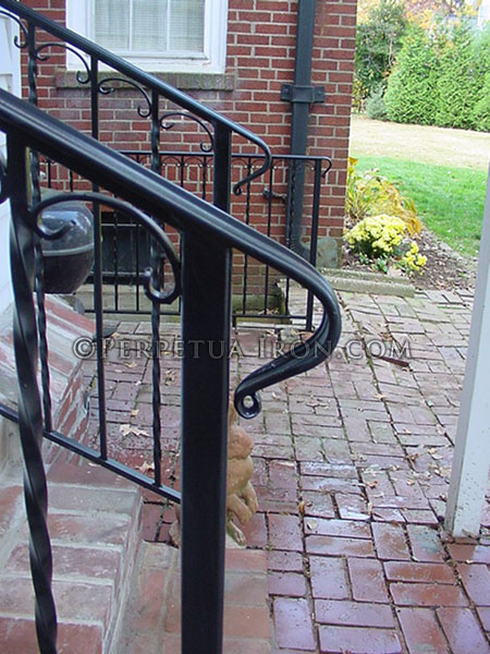 Exterior wrought iron railing, 2 channel design with ball cap finials.
